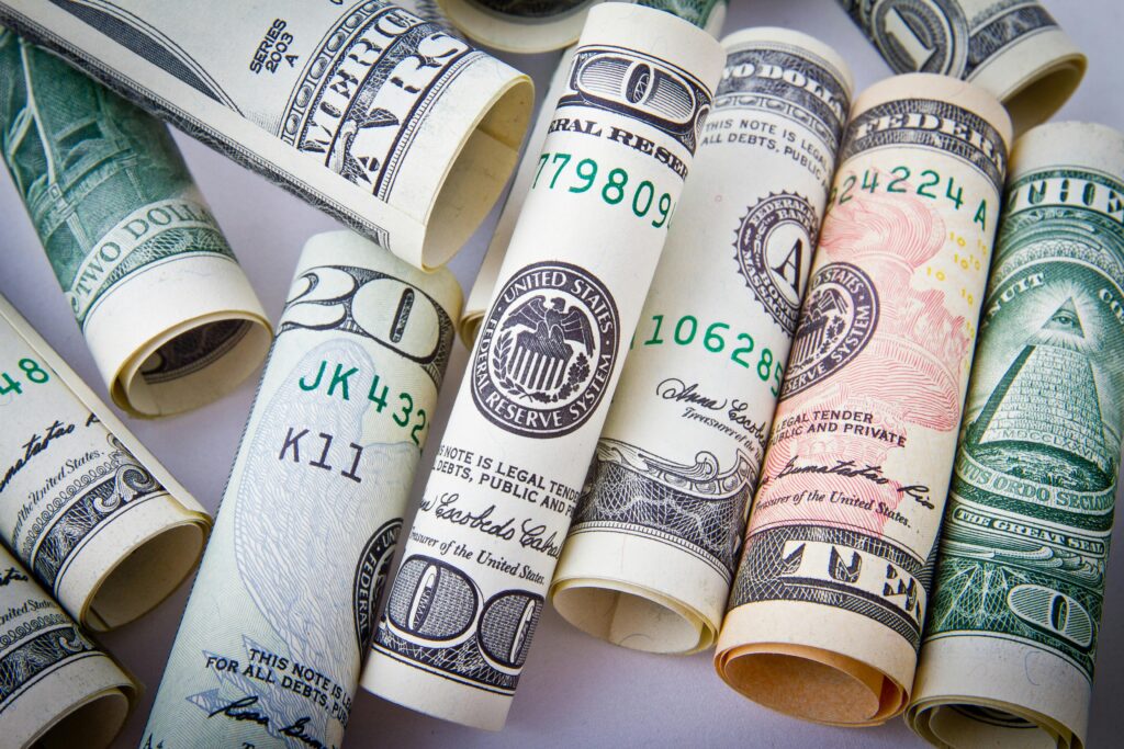 pexels photo 164527 164527 Close-up of rolled US dollar bills symbolizing wealth, financial success, and currency.